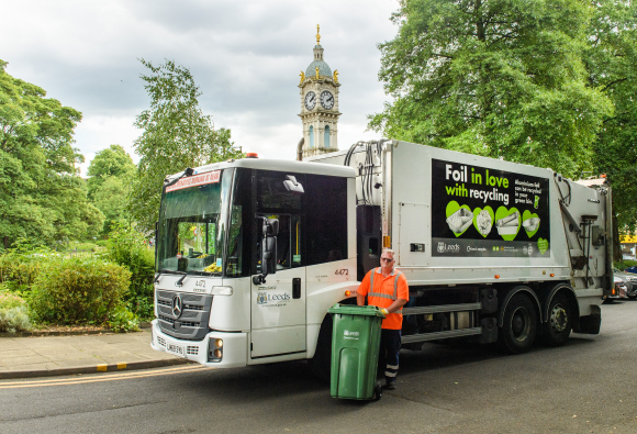 RCV collection vehicle with livery on side promoting foil recycling