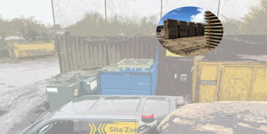 Stack of wooden pallets, with large waste containers and vehicles on a site 